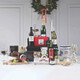 Christmas Eve Irish Casket Hamper featuring premium wines, champagne, mince pies, Christmas pudding, chocolate biscuit cake, Irish cheeses, Bewley’s coffee, Barry’s Tea, gourmet cookies, preserves, and festive treats elegantly arranged with holiday decorations – available at GiftsDirect.com Christmas Eve Irish Casket Hamper featuring premium wines, champagne, mince pies, Christmas pudding, chocolate biscuit cake, Irish cheeses, Bewley’s coffee, Barry’s Tea, gourmet cookies, preserves, and festive treats elegantly arranged with holiday decorations – available at GiftsDirect.com
